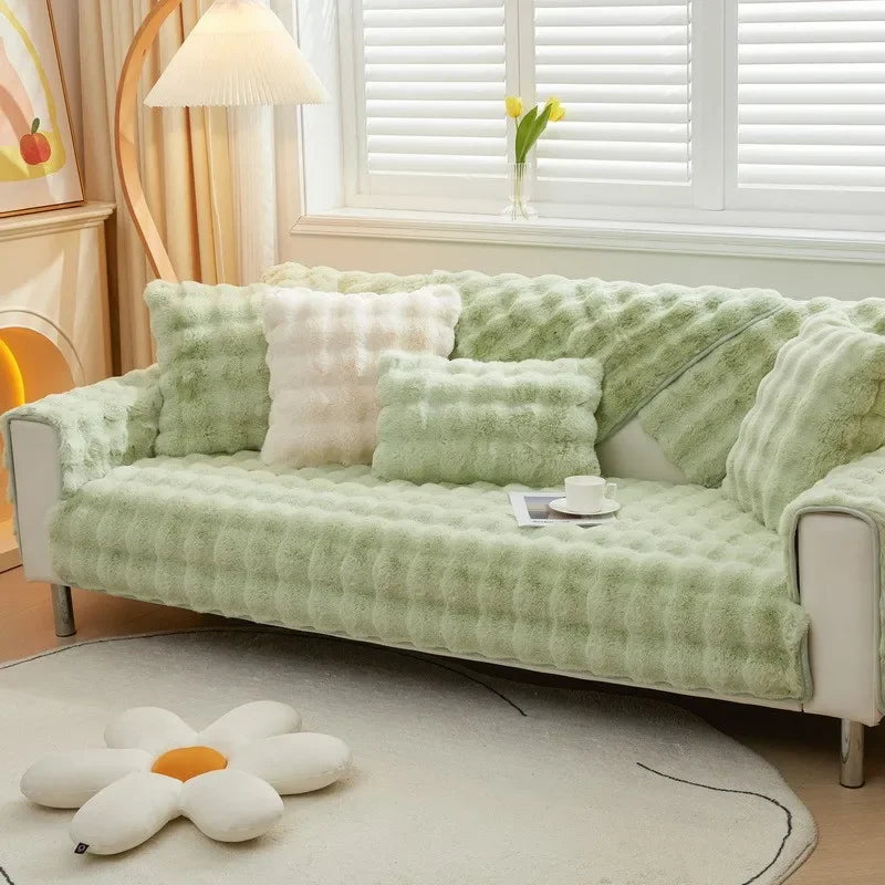 Housse de canapé en fausse fourrure de couleur vert pastel